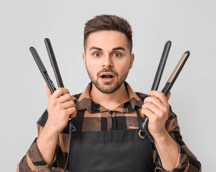 man with hair straighteners